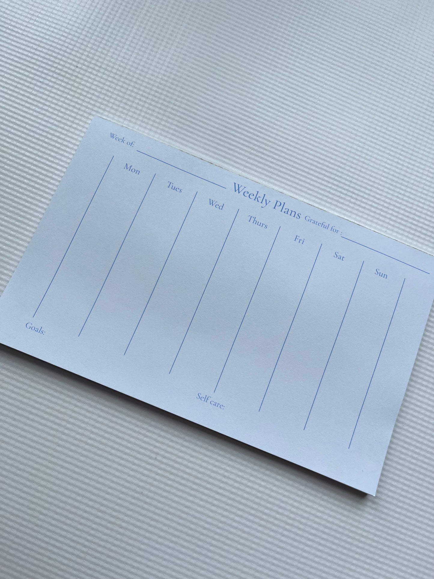Green weekly planner notepad