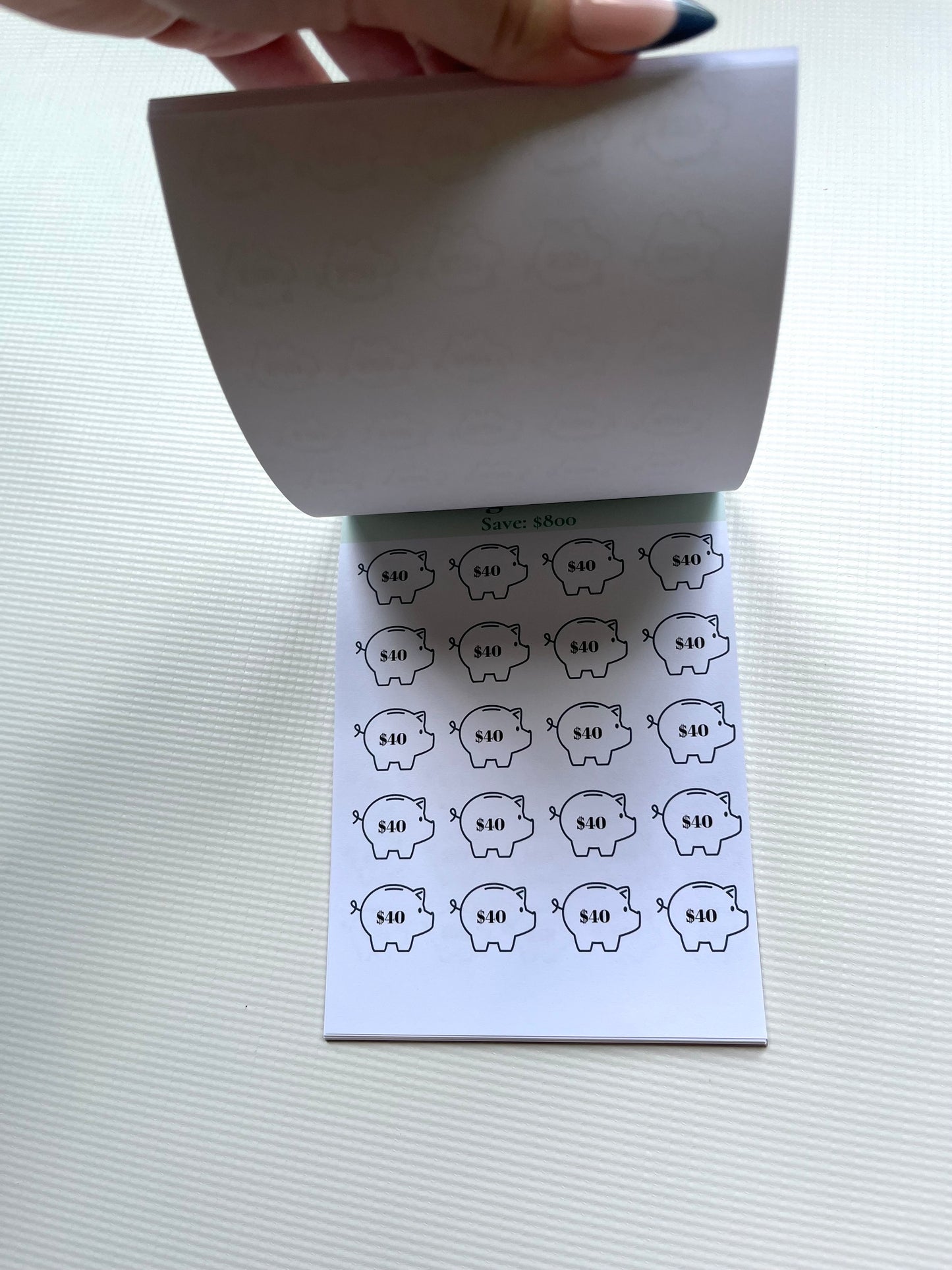 Savings tracker notepad