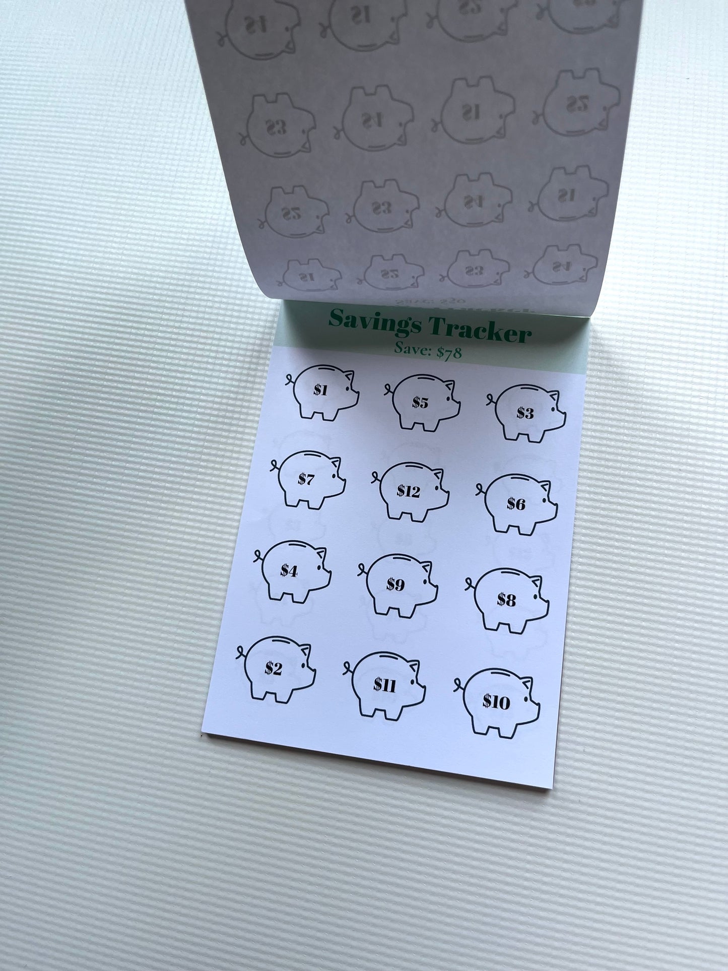 Savings tracker notepad