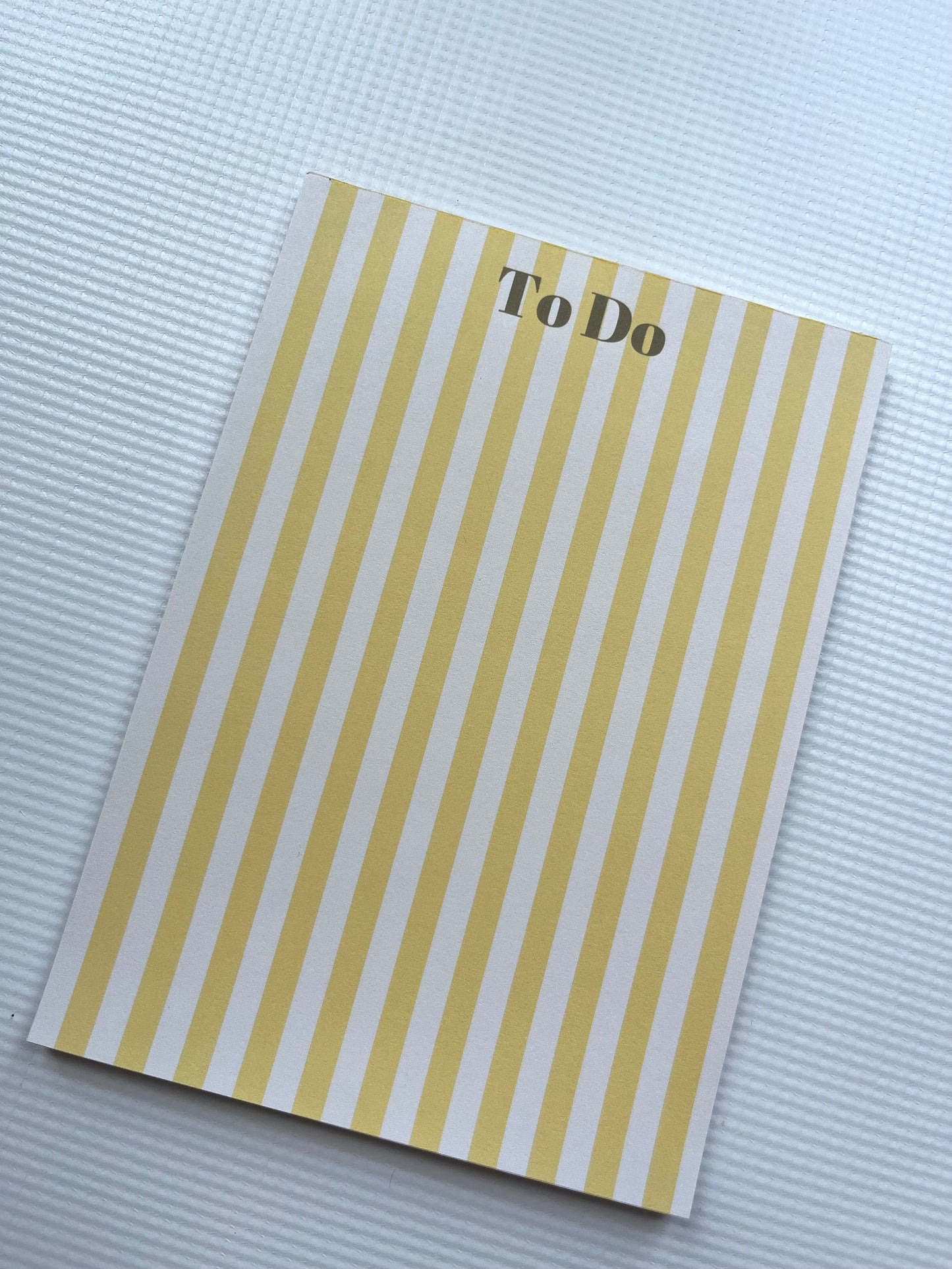 Yellow striped to do list notepad