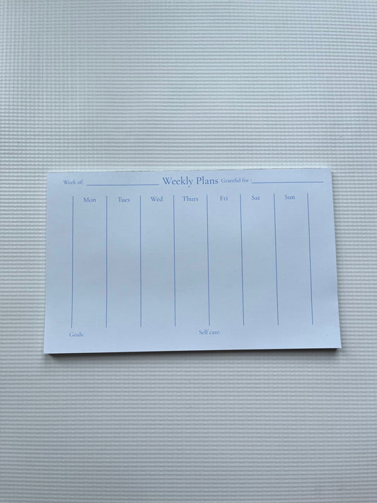 Green weekly planner notepad